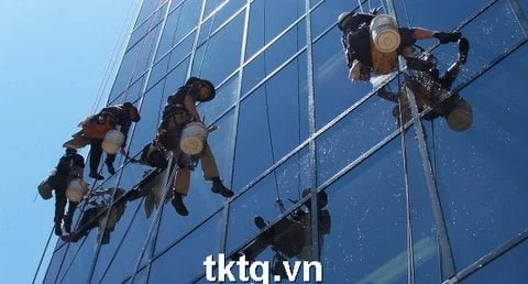 Photo: cleaning service of high-rise glass using rope
