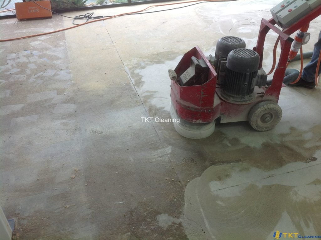 Concrete ground grinding services are removing glue and paint