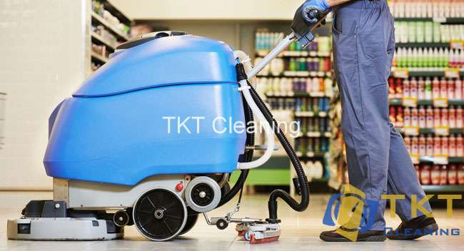 Photo: staff cleaning the shopping mall aisle area